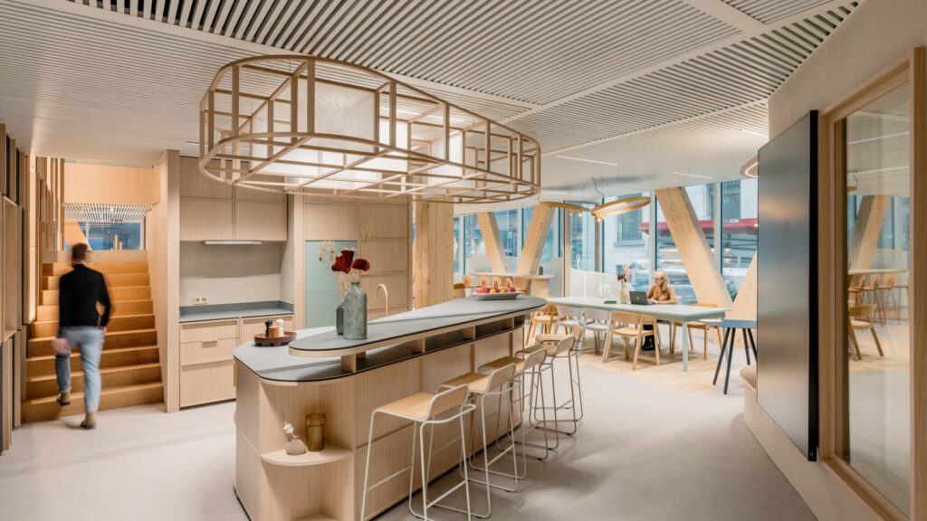 Office interior offering a variety of settings, from open social space to protected seating